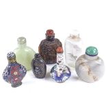 A group of Chinese snuff bottles, including relief carved amber, and mother-of-pearl inlaid