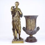 A polished bronze Classical figure, probably early 20th century, height 42cm, and a relief cast