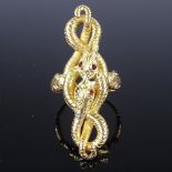 A large unmarked high carat gold entwined snake finger ring, serpents set with garnet eyes with