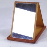 A leather-covered travelling mirror, monogrammed HRH, length 17cm