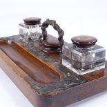 A Victorian mahogany desk stand, with brass serpent design handle, and original cut-glass inkwells