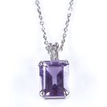 A modern 9ct white gold amethyst and diamond pendant necklace, on 9ct white gold trace link chain,