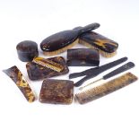 A group of tortoiseshell items, including 2 boxes, a cigarette case, dressing table items etc