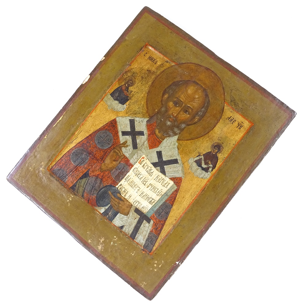 A 19th century Russian painted and gilded icon on wood panel, 27cm x 22cm Several minor paint - Image 2 of 3