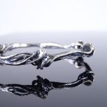 A Danish unmarked silver modernist naturalistic slave bangle, wrought twisted design, internal