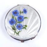 An Elizabeth II silver and enamel circular compact, engine turned sunburst decoration with hand