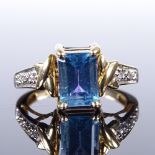 A modern 9ct gold amethyst blue topaz and diamond reversible swivel head dress ring, setting