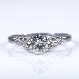 An early 20th century platinum 0.35ct solitaire diamond ring, engraved leaf shoulders, diamond