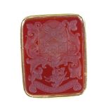 A 19th century 18ct gold intaglio carved carnelian seal fob, armorial crest with unicorn dragon