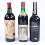A bottle of Chateau Loudenne Medoc, a bottle of Torgiano Rubesco 1968, and a bottle of Fonseca