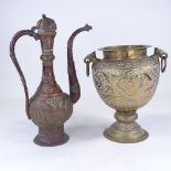 An Indian engraved brass 2-handled pot, height 32cm, and a Continental copper and brass ewer (2)