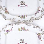 A pair of Chamberlain's Worcester armorial platters in gilded floral decorated surrounds, 31cm