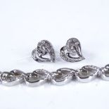 A modern sterling silver and diamond heart design matching bracelet and earrings set, bracelet