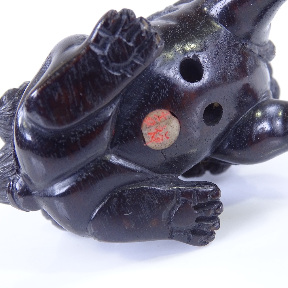 A Japanese carved and stained wood Dog of Fo design netsuke, signed, length 6cm - Image 3 of 3