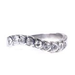 A late 20th century 9ct white gold diamond half eternity ring, total diamond content approx 0.