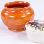 Moorcroft Pottery pot and cover, diameter 11cm, and a Moorcroft orange lustre glaze bowl (2)