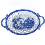 A 19th century blue and white transfer printed Creamware basket, with pierced lattice sides,