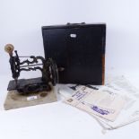 An Antique Newton & Wilson sewing machine in original wooden box, height 24cm, and a quantity of