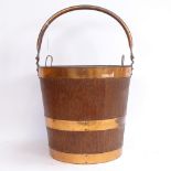 A Vintage coopered oak coal bucket/waste paper bin, with copper liner and swing handle, height