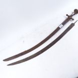 A pair of Middle Eastern curved swords, length 87cm