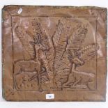 A Zimbabwean relief embossed copper plaque, depicting Mutete tree and boks, 44cm x 48cm