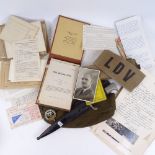 A Second World War Army cap, belt, LDV armband, knife in scabbard, various ephemera, and photographs