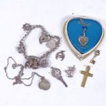 A 9ct gold cross, and a 9ct gold 21 key pendant, silver charm bracelet etc