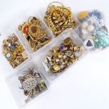 4 boxes of various costume jewellery, to include a large quantity of brooches