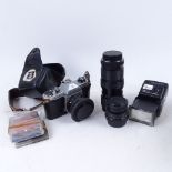 A Pentax K1000 camera, a Vivitar lens, and accessories in case