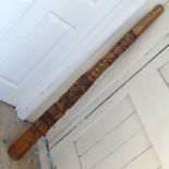 A modern Aboriginal style carved hardwood didgeridoo, length 130cm