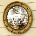 An early 20th century gilt-gesso circular convex wall mirror, overall diameter 40cm