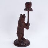 A 19th century carved wood Black Forest bear design candlestick, height 26cm