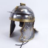 A handmade military re-enactment steel and brass Roman style helmet, 16 gauge steel