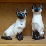 Pair of Winstanley Siamese cats, largest height 24cm
