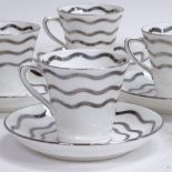 An Art Deco Collingwood set of 6 bone china coffee cans and saucers, model no. 6858, silver wavey