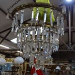 A large brass-framed 3-tier hanging light fitting, with tears of baguette-cut arrowhead glass lustre