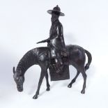 An Oriental bronze figure of a horseman (in 2 parts), height 42cm