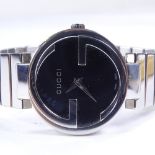 GUCCI - a lady's stainless steel monogram quartz wristwatch, ref. 133.5, black dial with original