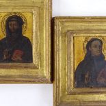 A pair of 19th century painted and gilded portraits of saints in giltwood frames, overall frame size