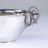 An Elizabeth II cast-silver 2-handled sugar bowl, cast naturalist vine and boy decorated handles,