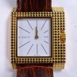 GUCCI - a gold plated stainless steel 7100M quartz wristwatch, white dial with gilt baton hour