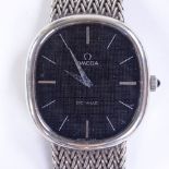 OMEGA - a Vintage sterling silver Deville mechanical wristwatch, black oval dial with baton hour