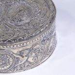 An early 19th century Dutch silver circular box, hinged lid decorated with coronet and relief