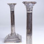 A pair of late Victorian silver Corinthian column table candlesticks, by William Hutton & Sons