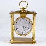 BUCHERER - a Vintage brass-cased 4-pillar 8-day mantel clock, silvered dial with Roman numeral