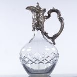 An Art Nouveau cut-glass Claret jug, with electroplate mount, overall height 27cm Plating very