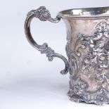A Victorian silver half pint mug, allover floral and foliate relief embossed decoration, by Thomas