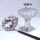 An Elizabeth II turned ebony-handled silver toddy ladle, hallmarks Sheffield 1973, and a silver-