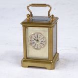 A miniature brass-cased carriage clock, printed dial with Roman numeral hour markers and silvered