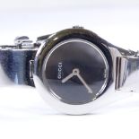 GUCCI - a lady's stainless steel 6700L quartz wristwatch, mirror dial with bangle style bracelet,